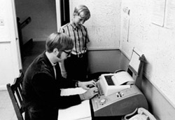 Bill Gates, an eight-grader, looks over the shoulder of Paul Allen, a tenth-grader, in this 1968 photo taken at the Lakeside School's computer desk. Photo courtesy of Lakeside School.