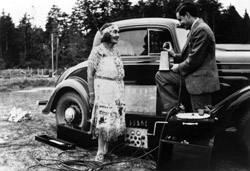 Anthropology Professor Melville Jacobs records the voice of Annie Miner Peterson with his newly built portable electric phonograph during his visit to Charleston, Ore., in July 1934. Photo courtesy MSCUA, University of Washington Libraries, Negative #UW23239z.