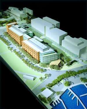 Most of the $70 million Gates Foundation gift will fund the construction of a 265,000 square-foot research facility located at the southeast corner of N.E. Pacific Street and 15th Avenue N.E. At left is a model of the new building, which will be clad in terra cotta n two sides. Photo courtesy Anshen + Allen Architects.