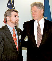 A bearded Mark Emmert chats with then President Bill Clinton at a 1995 library dedication at the University of Conneticut. Emmert was the UConn chancelor at the time. On May 21, Emmert hosted another sitting U.S. president as President George W. Bush delivered the 2004 announcement address at LSU. Photo courtesy Peter Morenus, Jr., University of Conneticut.