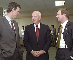 Left to right, UW Medical School Dean Paul Ramsey, who was cho-chair of the presidential search advisory committee, Regent Dan Evans, '48, '49, and incoming President Mark Emmert confer during a March 22 press conference at the UW. Photo by Kathy Sauber.