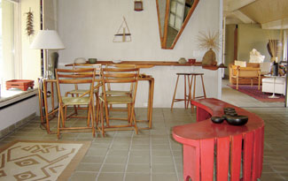 Inside Larsen's Long Island retreat is his collection of furniture and artifacts such as Wharton Esherick's 1939 World's Fair dining table. Photo courtesy LongHouse Reserve.