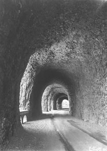 The Mitchell Point Tunnel on Oregon's original Columbia River Highway was engineered by John Elliott, '09, '29. Blasted through solid rock, it featured five windows overlooking the river. Photos courtesy Special Collections, University Libraries.