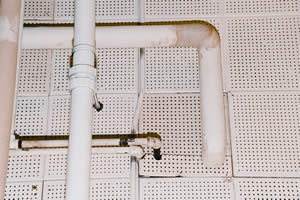 Water leaks have damaged ceiling tiles and pipes in Johnson Hall. Photo by Kathy Sauber.