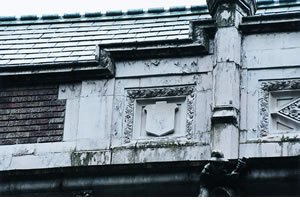 Paint peels and flakes off the ornate panels of Savery Hall on the UW's famous Quad. Photo by Kathy Sauber.