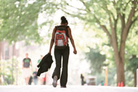 A lone student walking on campus. Photo by Dennis Wise.