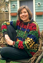 Stephanie Kallos today poses in her backyard. Photo by Mary Levin.