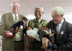 During a 2002 tour of Africa to investigate health care, Bill Gates Sr. and former President Jimmy Carter met with former South African President Jimmy Carter met with former South African President
              Nelson Mandela. Above the three are holding healthy babies whose mothers
              were treated with an inexpensive drug that helps prevent the transmission
              of the AIDS virus. Gates is co-chair of the Bill & Melinda Gates Foundation,
              which has committed more than $3 billion to global health. Photo courtesy
            the Bill & Melinda Gates Foundation. 