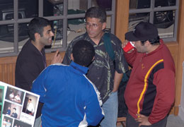 CLUE founder Stan Chernicoff (center) consults with students. Photo by Mary Levin.