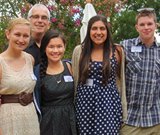 A group of students and alumni at an  event.