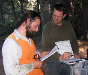 Andrew Larson, '03, '09, and Jim Lutz, '05, '08, review data from the Yosemite Forest Dynamics Plot