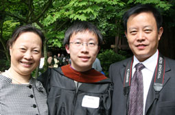 Ziyu Ma, 10, with proud family at commencement.