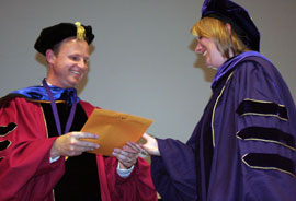 Chair David Domke and Ph.D. candidate Jessica Harvey