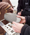 Measuring cobblestones on the beach