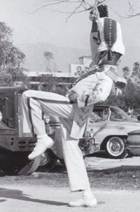 Drum major Bob Flennaugh practices in front of the Rose Bowl.