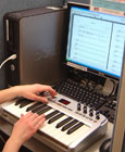 Workstation with MIDI keyboard and music composition software