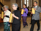 Thai delegates present the 40-volumne canon to the UW Libraries