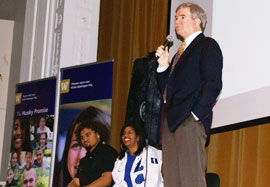 Amosa, left,  Brown and  UW President Mark Emmert