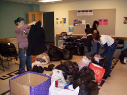 OSSW students sort through 50 bags of clothing