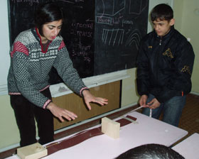 Mohadjer works hands-on with students