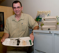 Michael Meyering, project manager for Housing and Food Services, shows a range of biodegradable, compostable cutlery for use at the UW.