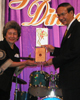 Kraisi Karnasuta (right), head of the Thai Electricity Generating Authority, receives the  Alumnus of the Year – Thailand Chapter Award.