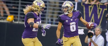 Husky football player Dante Pettis celebrates a touchdown.