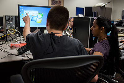 Two students using a computer.