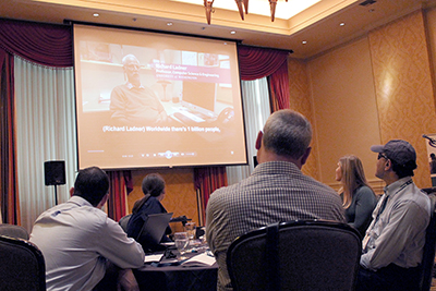 A video plays Richard speaking while participants watch.