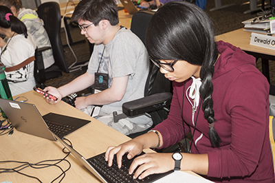 Two students working on computers.