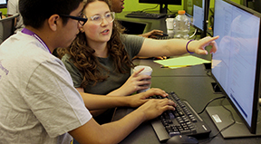 A student and educator work on a quorum project together. A student and educator work on a quorum project together.