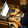 Photo of a person using a laptop