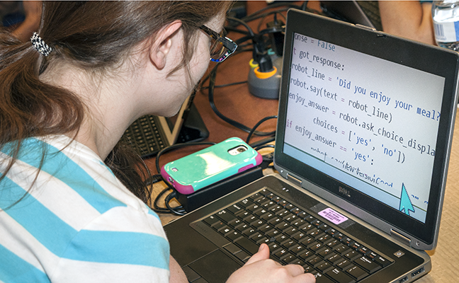 A student with low vision works on a computing project