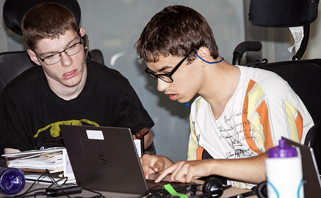 Two students working on a computing project