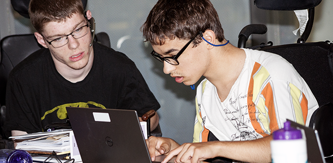 Two students working on a computing project