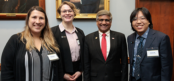 NSF Director Sethuraman Panchanathan (center right) with NSF CSGrad4US Fellows Kate Glazko (left), Sarah Boelter (center left), and Steven Shi (right). Photo credit: Charlotte Geary/NSF.