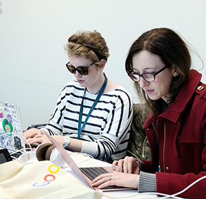 A visually impaired educator and a student from the 2019 OurCS workshop.