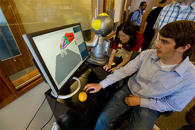 A man interacting with a computer