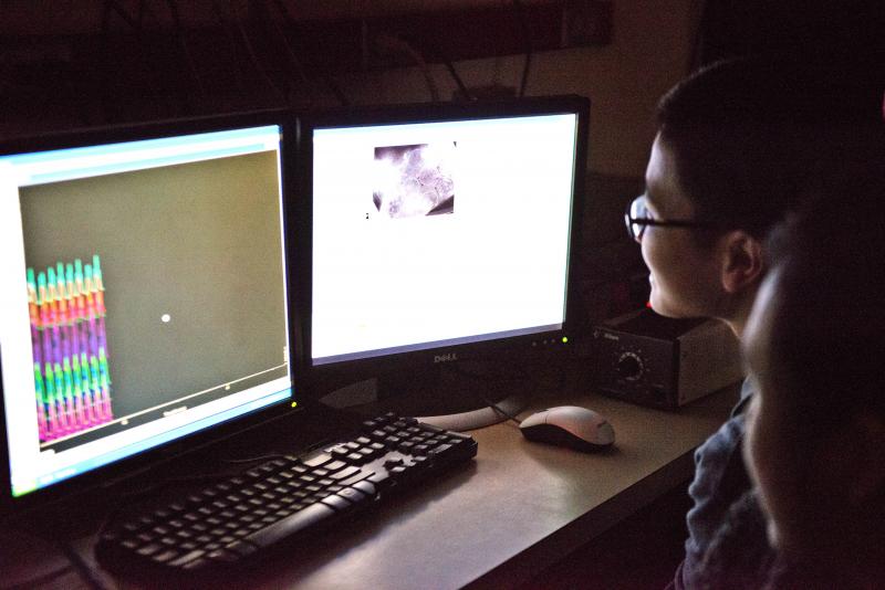 Two students work on a computing project.