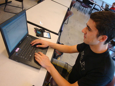 Image for AccessComputing January 2012 Engage page of student on a computer.
