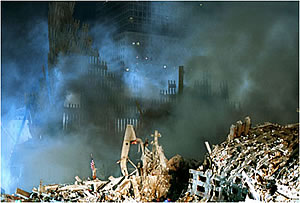 A flag marks the center of Ground Zero on the night of Sept. 12. Copyright 2001 Samantha Appleton, '97.