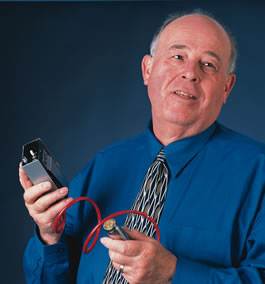 Don Baker shows off the ultrasound prototype he developed in the UW bioengineering lab in the early 1960s. Photo by Kathy Sauber.