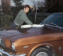 An excited Mark Emmert polishes his family's 1965 Ford Mustang prior to driving it to the Fife High School prom. Photo courtesy Mark Emmert.