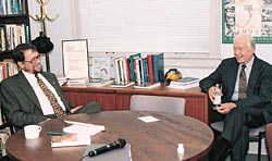 The late Evans School Dean Marc Lindenberg meets meets with former President Jimmy Carter during Carter's 2000 visit to UW. Photo by Mary Levin.