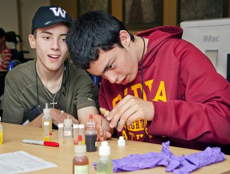 Image of two students working together during a science lab.