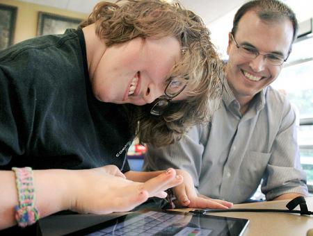 Image of a student working on a tablet with an instructor during EXO labs.