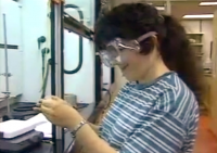 still image from video College YCDI showing DO-IT Scholar performing a science experiment