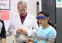 still image from video Equal Access Sensory showing students performing an experiment with an instructor