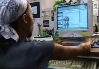 still image from video Learning and Earn Tips showing DO-IT Scholar using assistive technology at computer