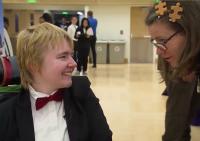 A student in a wheelchair meets a job recruiter.